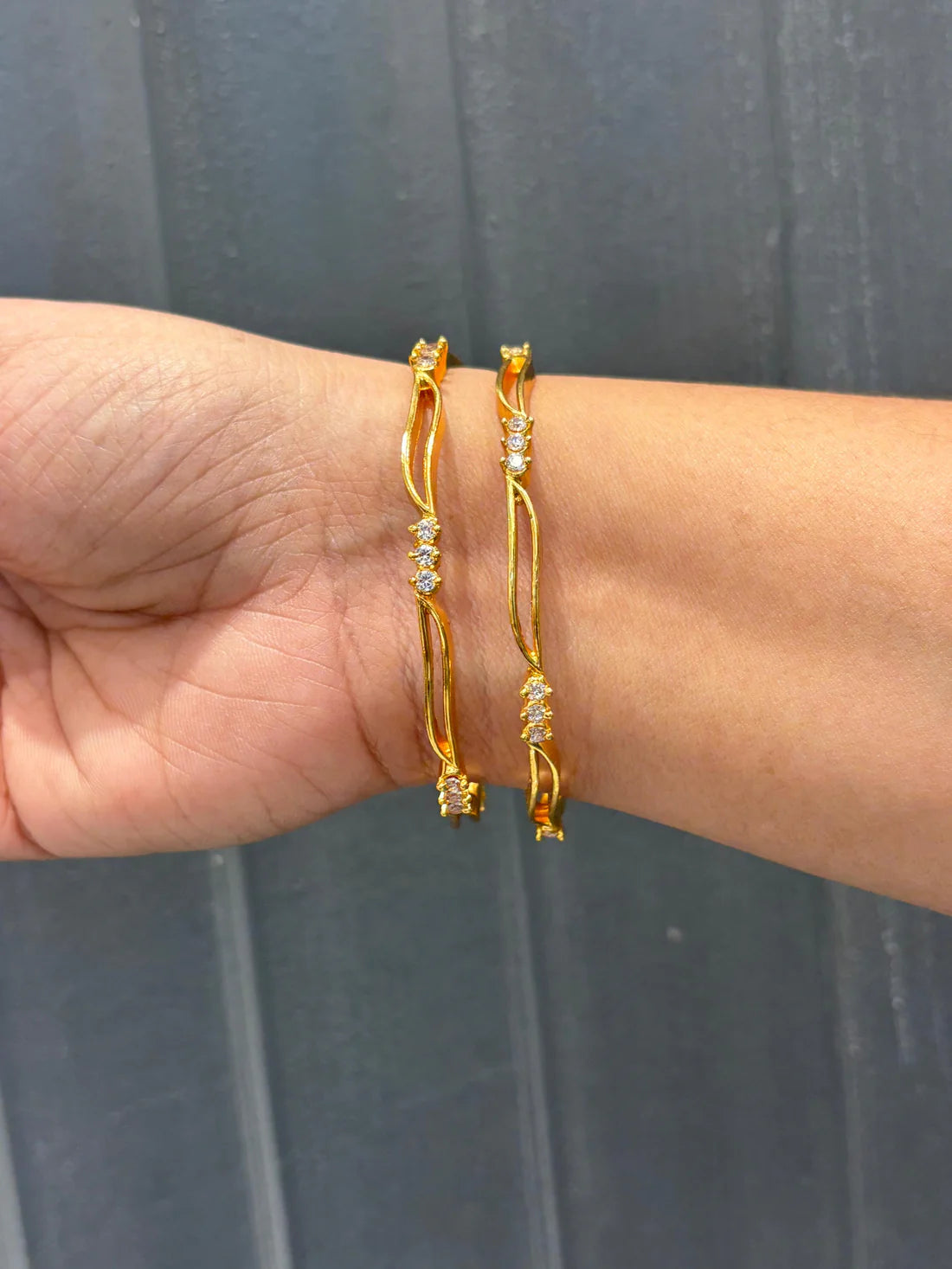 Wavy Gold Bangles with CZ Stones – Chic & Modern