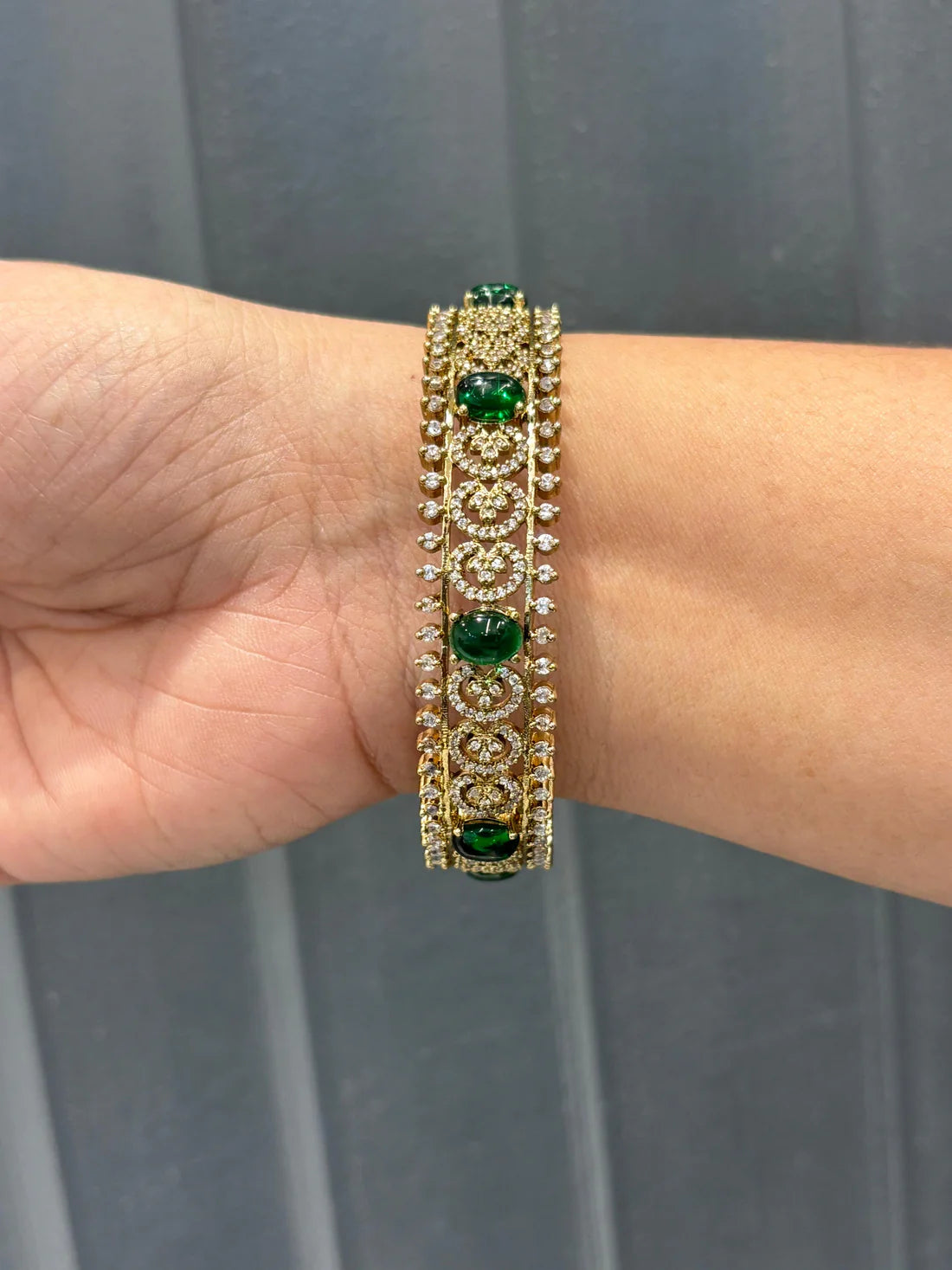 Regal Emerald & CZ Studded Designer Gold Bangle
