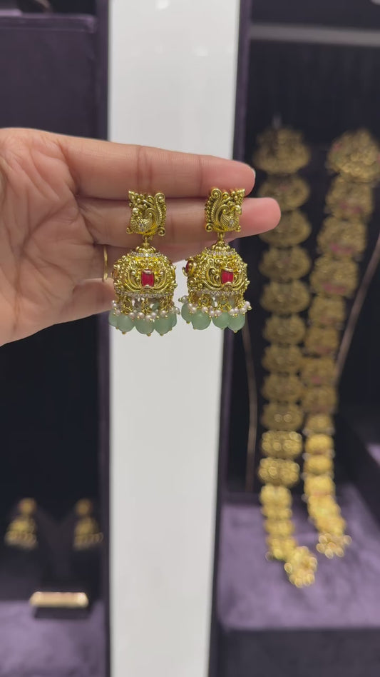 Regal Jhumka Earrings with Red Enamel and Green Bead Drops