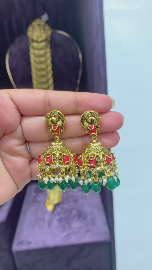 Traditional Jhumka Earrings with Red Enamel and Green Bead Accents