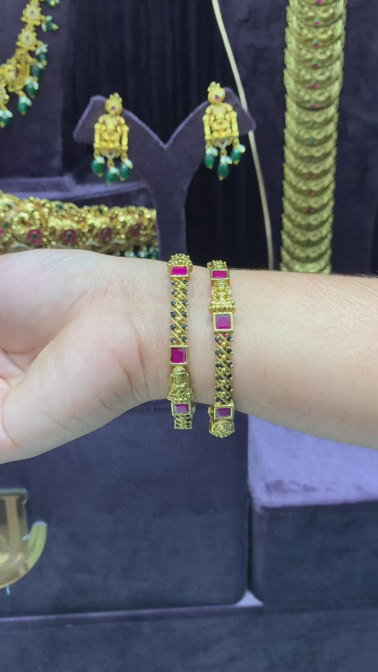 Traditional Temple Gold-Tone Bangles with Black Beads and Ruby Accents