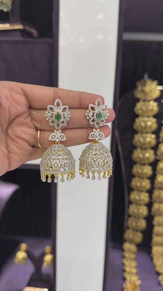 Elegant Silver and Gold-Tone Jhumka Earrings with Green Stone Accent